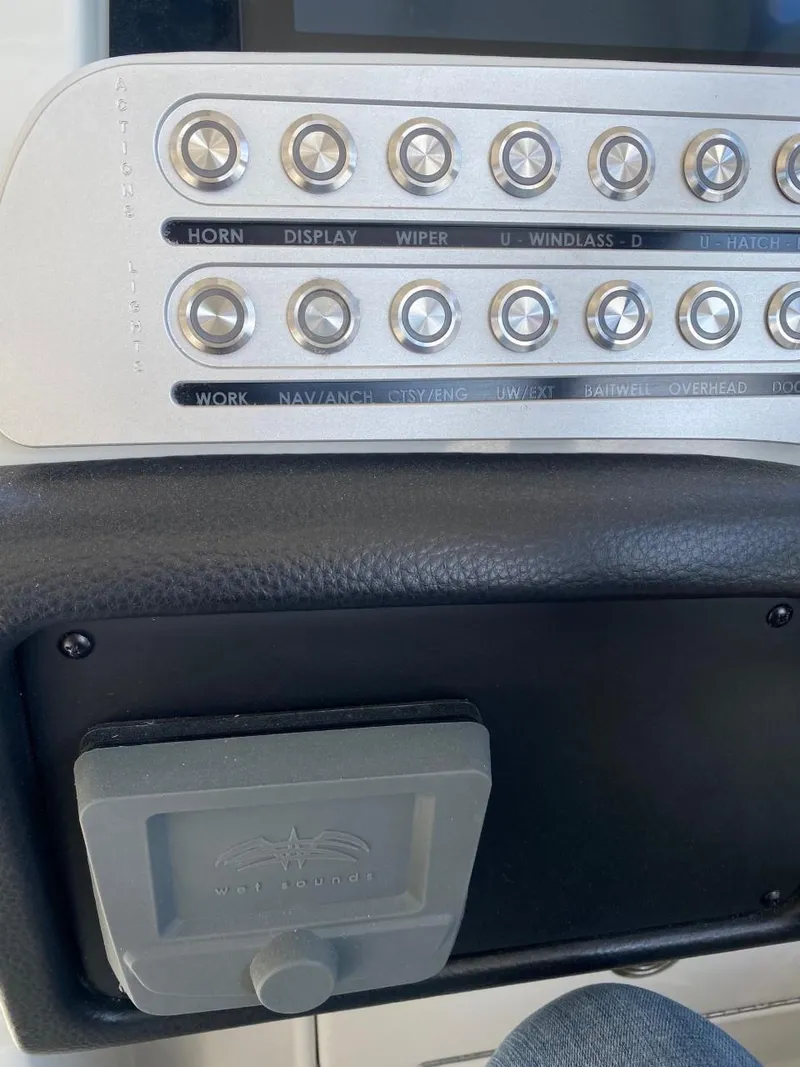 Slide: The Image of Close-up of a control panel with multiple buttons and a small screen. - 18