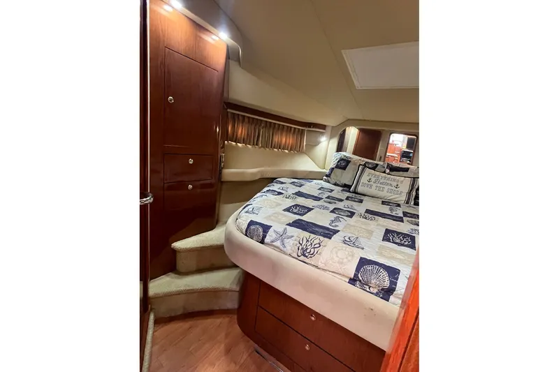 Slide: The Image of Luxurious cabin interior of 2002 Sea Ray 480 Motor Yacht with cozy bedding. - 25