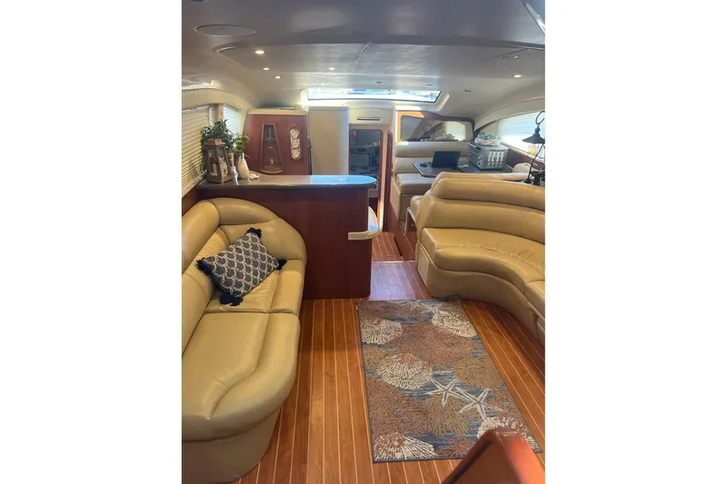 Slide: The Image of Luxurious interior of 2002 Sea Ray 480 Motor Yacht with plush seating and elegant decor. - 23