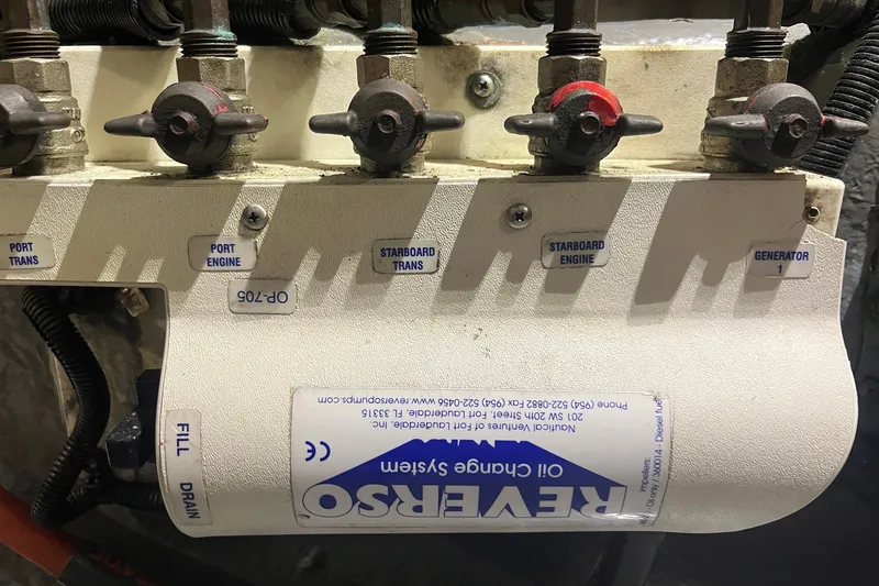 Slide: The Image of Oil change system on a 2002 Sea Ray 480 Motor Yacht with labeled valves. - 21