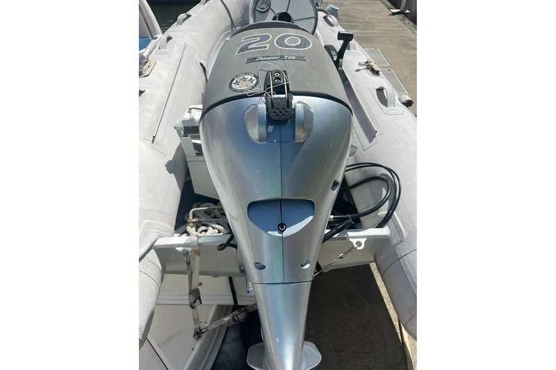 Slide: The Image of Outboard motor on a 2002 Sea Ray 480 Motor Yacht, docked and ready for use. - 7