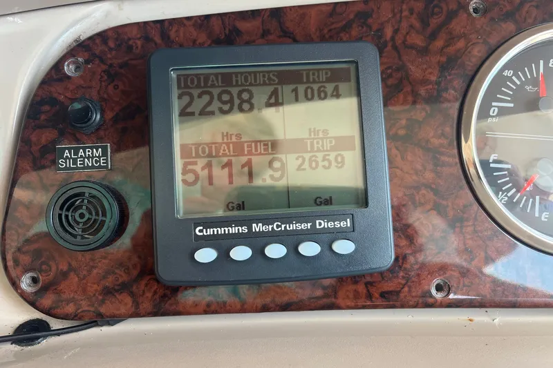 Slide: The Image of Dashboard of 2002 Sea Ray 480 Motor Yacht showing engine hours and fuel usage. - 11