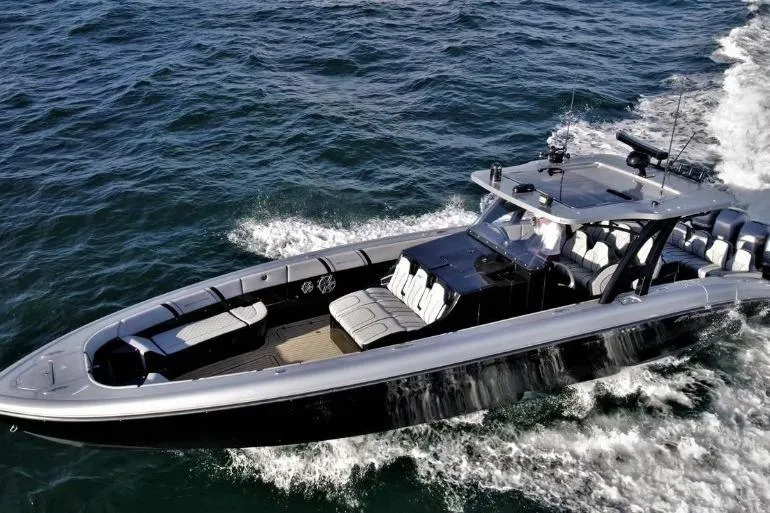 Slide: The Image of 2019 Midnight Express 43 Open boat cruising on the ocean. - 1