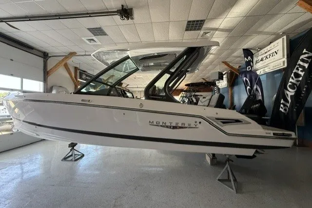 The Image of 2027 Monterey Elite 27 SD boat displayed indoors on stands. - 0