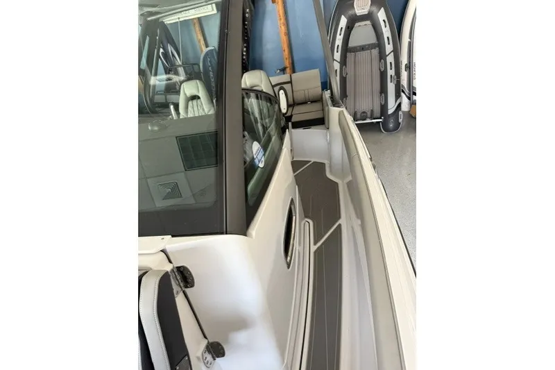 Slide: The Image of 2027 Monterey Elite 27 SD boat interior with sleek seating and modern design. - 13