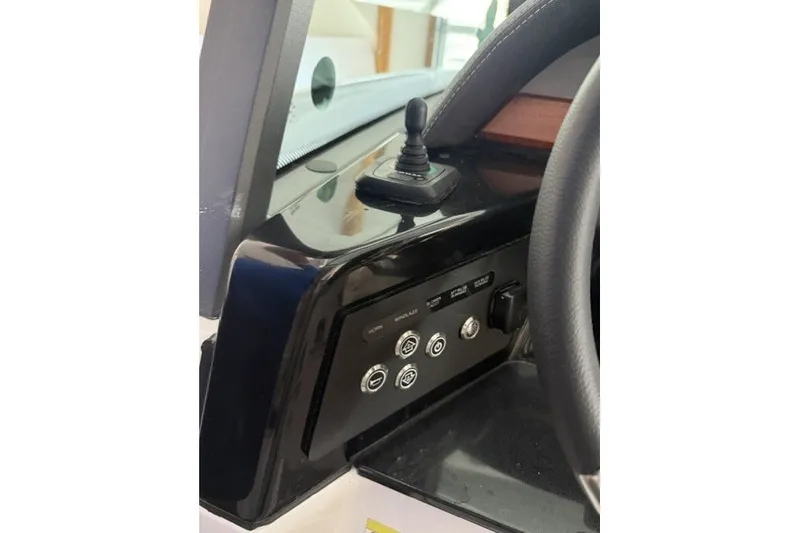 Slide: The Image of Dashboard controls of a 2027 Monterey Elite 27 SD boat. - 10