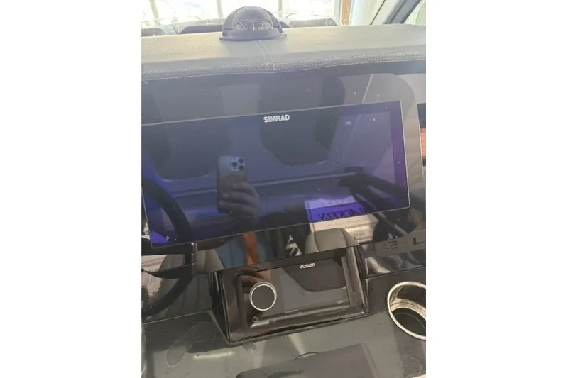 Slide: The Image of Dashboard of a 2027 Monterey Elite 27 SD boat with Simrad display. - 7