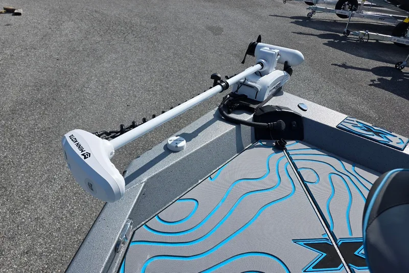 Slide: The Image of 2027 Xpress H20B Bay boat with Minn Kota trolling motor on deck. - 11