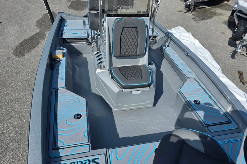 Slide: The Image of 2027 Xpress H20B Bay boat interior with sleek seating and storage compartments. - 13