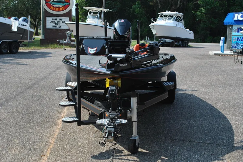 Slide: The Image of 2021 Blazer 650 Pro Tour boat on trailer at a marine dealership. - 5