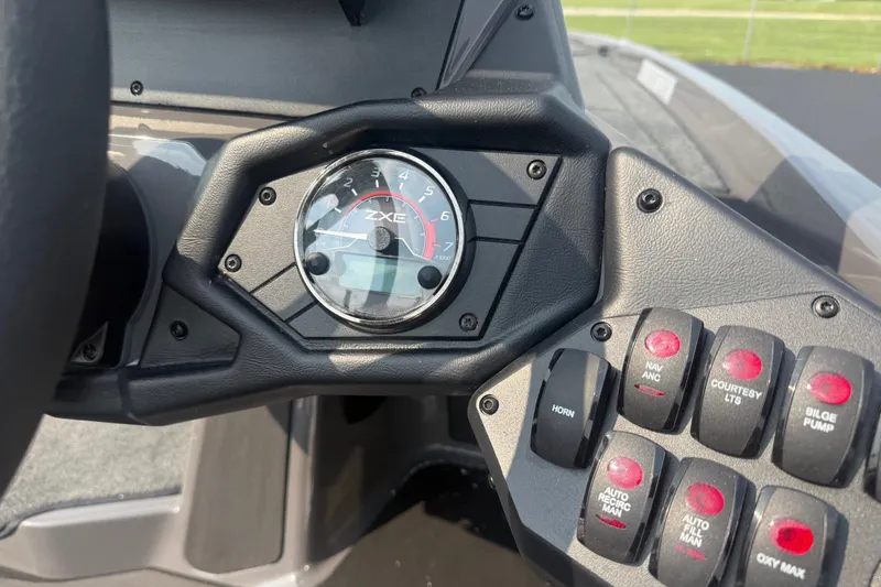 Slide: The Image of Dashboard of 2027 Skeeter ZXE20 boat with gauges and control switches. - 22