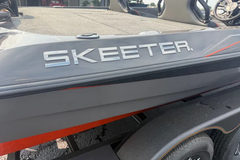 Slide: The Image of 2027 Skeeter ZXE20 boat, close-up of logo and sleek design. - 18