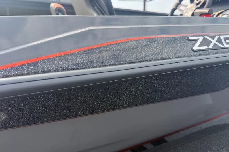 Slide: The Image of 2027 Skeeter ZXE20 boat detail with sleek design and red accent stripe. - 19