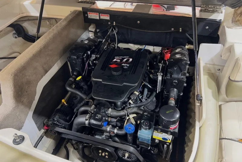 Slide: The Image of Engine compartment of a 2004 Sea Ray 200 Select boat, featuring a MerCruiser 5.0 MPI engine. - 8