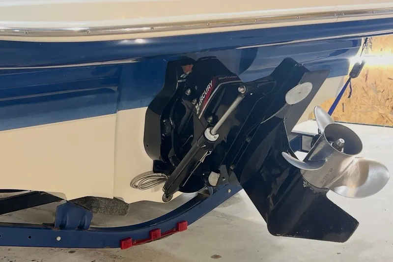 Slide: The Image of 2004 Sea Ray 200 Select boat with Mercury outboard motor and propeller. - 17