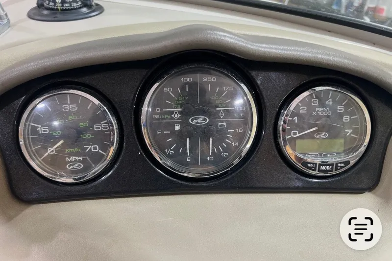 Slide: The Image of Dashboard gauges of a 2004 Sea Ray 200 Select boat, showing speed, fuel, and RPM. - 11