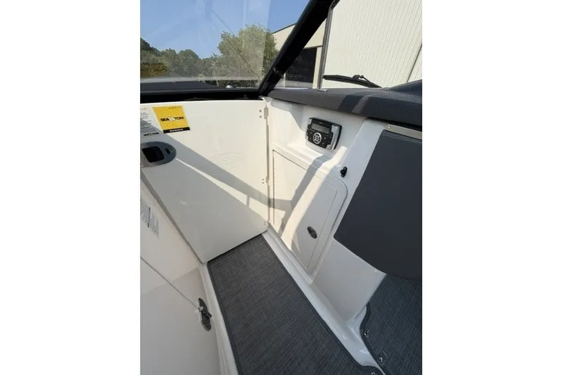 Slide: The Image of Interior view of 2015 Chaparral 257 SSX boat, featuring dashboard and seating area. - 20