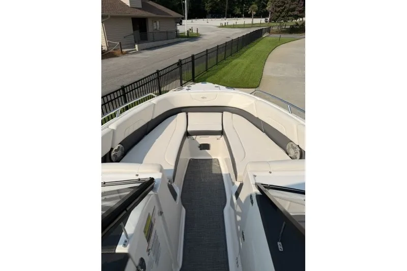 Slide: The Image of 2015 Chaparral 257 SSX boat interior with spacious seating and sleek design. - 8