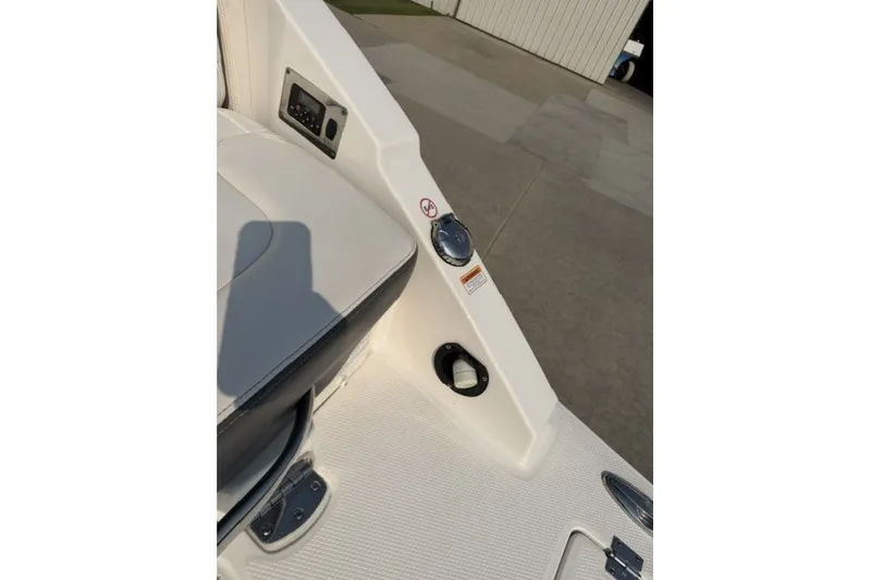 Slide: The Image of 2015 Chaparral 257 SSX boat interior detail with seating and control panel. - 14