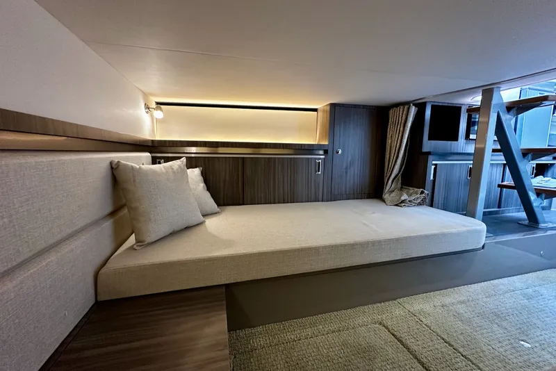 Slide: The Image of Interior of a 2021 Sea Ray Sundancer 320 Outboard with modern design and cozy lounging area. - 30