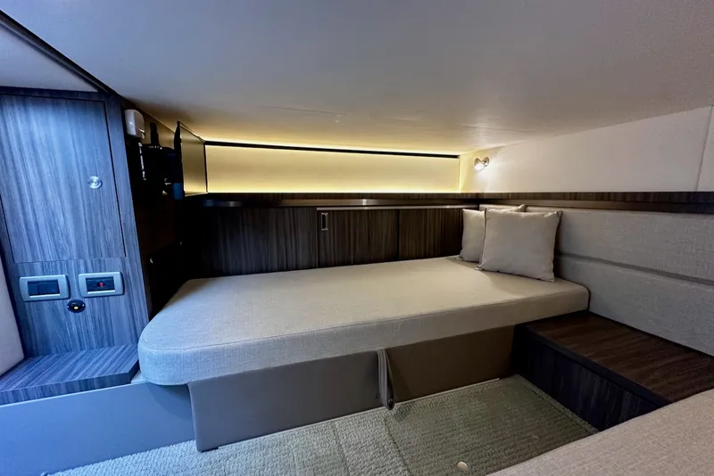 Slide: The Image of Interior of a 2021 Sea Ray Sundancer 320 Outboard with modern design and cozy lounging area. - 29