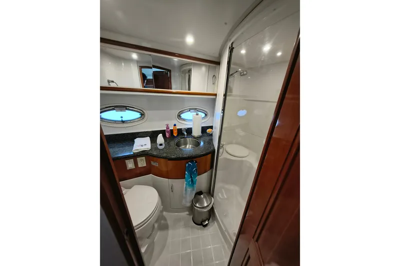 Slide: The Image of Luxurious bathroom in 2006 Carver 444 Cockpit Motor Yacht with modern amenities. - 33