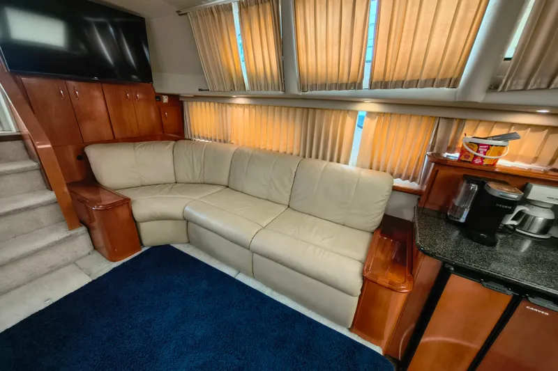 Slide: The Image of Interior of 2006 Carver 444 Cockpit Motor Yacht with beige sofa and kitchenette. - 20