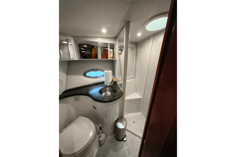 Slide: The Image of Bathroom interior of 2006 Carver 444 Cockpit Motor Yacht with modern fixtures. - 27
