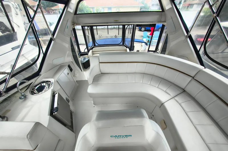 Slide: The Image of Luxurious interior of 2006 Carver 444 Cockpit Motor Yacht with white leather seating. - 15
