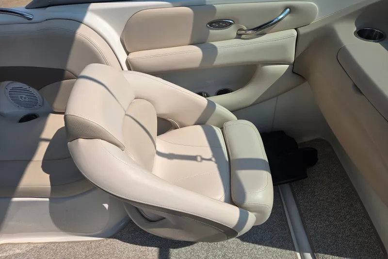 Slide: The Image of 2006 Chaparral 220 SSi boat interior with beige seating and sleek design. - 17