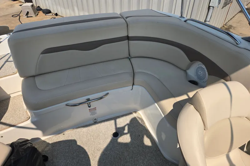 Slide: The Image of 2006 Chaparral 220 SSi boat interior with beige seating and speaker. - 18