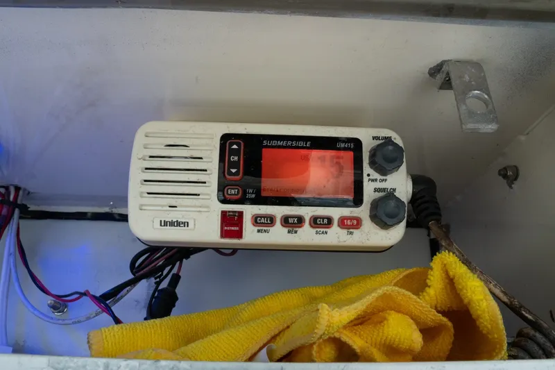 Slide: The Image of Uniden marine radio in a 1996 Mako 231 Center Console boat compartment. - 11