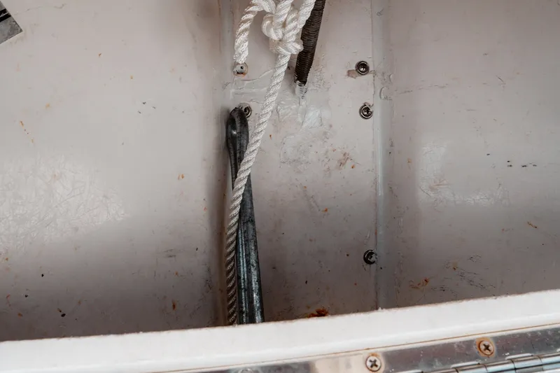 Slide: The Image of Anchor storage area on a 1996 Mako 231 Center Console boat. - 31