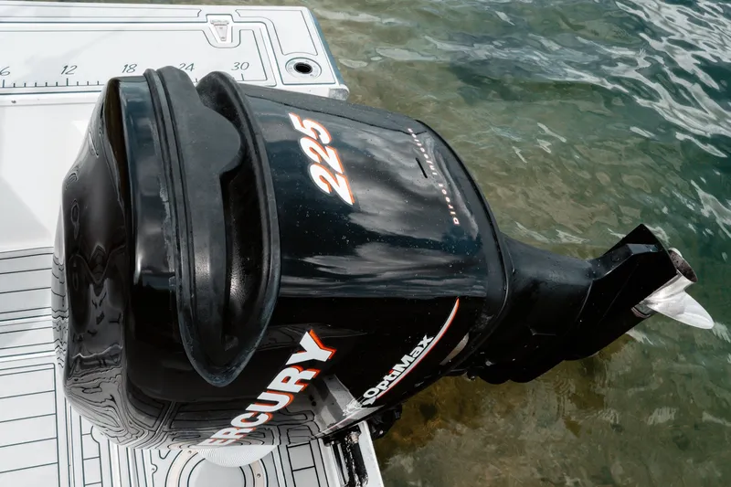 Slide: The Image of Mercury 225 outboard motor on 1996 Mako 231 Center Console boat in water. - 20