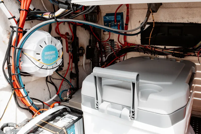 Slide: The Image of Electrical wiring and components inside a 1996 Mako 231 Center Console boat. - 43
