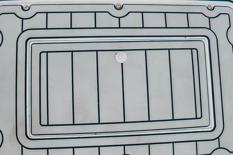 Slide: The Image of Deck of 1996 Mako 231 Center Console boat with intricate pattern design. - 41