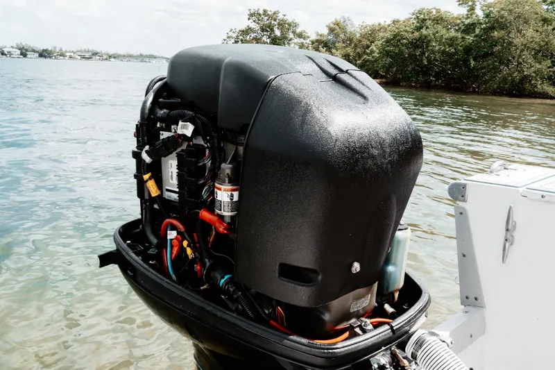 Slide: The Image of Outboard motor on a 1996 Mako 231 Center Console boat in shallow water. - 17