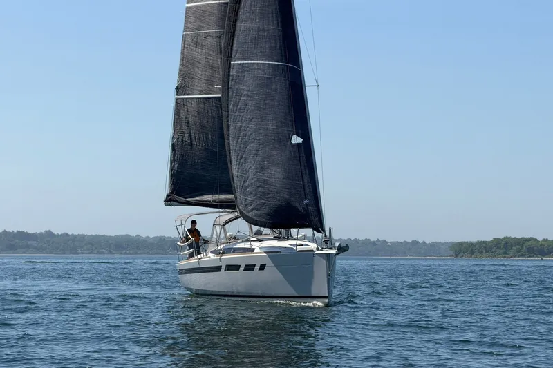 Slide: The Image of 2022 Jeanneau Sun Odyssey 349 Performance sailing on calm waters under clear skies. - 50