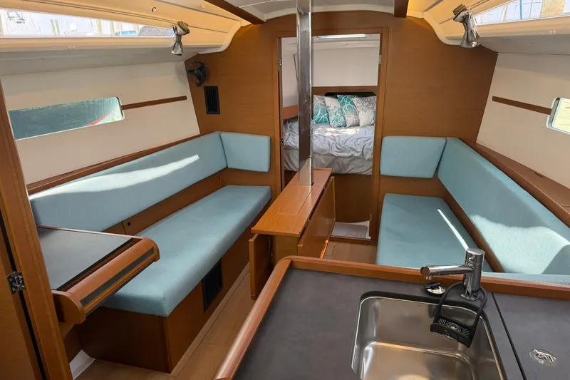 Slide: The Image of Interior of 2022 Jeanneau Sun Odyssey 349 Performance sailboat, featuring cozy seating and modern design. - 22