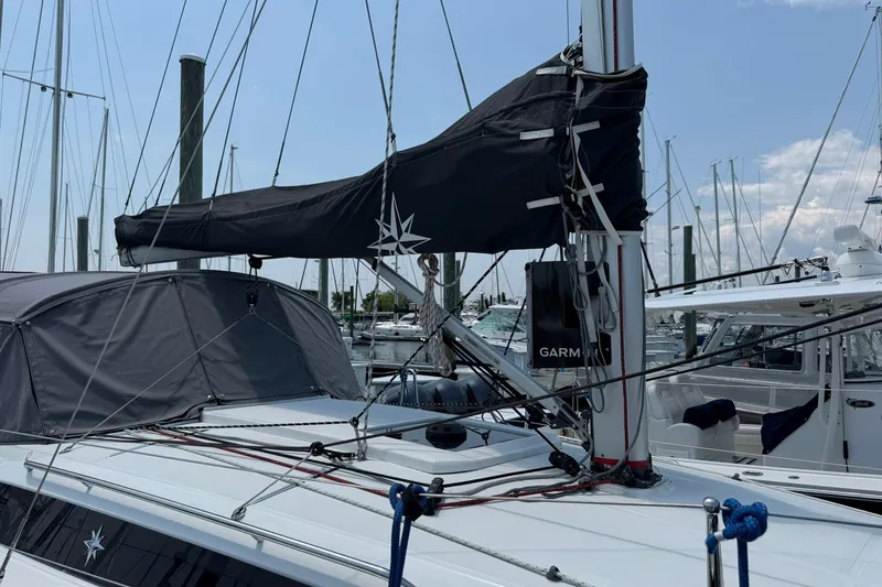 Slide: The Image of 2022 Jeanneau Sun Odyssey 349 Performance sailboat docked at marina. - 4