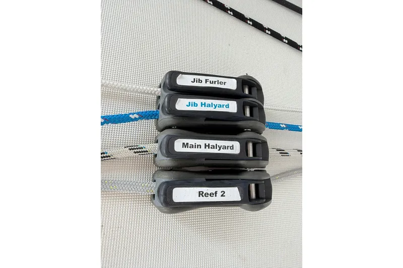 Slide: The Image of Control lines on Jeanneau Sun Odyssey 349 Performance, labeled for jib and main halyards, reefing. - 27