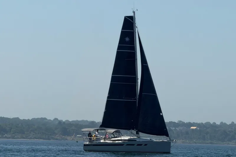 Slide: The Image of 2022 Jeanneau Sun Odyssey 349 Performance sailboat on calm waters. - 48