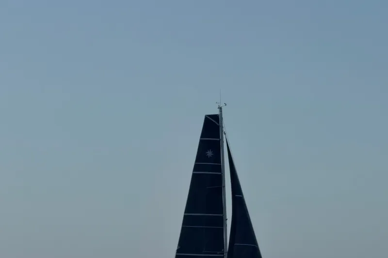Slide: The Image of Sailboat mast and sails of 2022 Jeanneau Sun Odyssey 349 Performance against clear sky. - 32