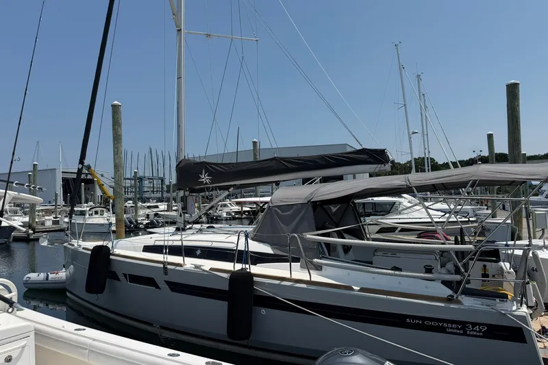 Slide: The Image of 2022 Jeanneau Sun Odyssey 349 Performance sailboat docked at a marina. - 40