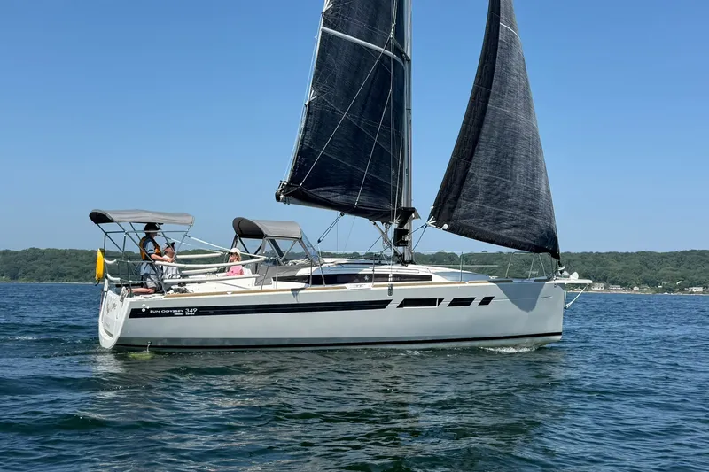 Slide: The Image of 2022 Jeanneau Sun Odyssey 349 Performance sailboat cruising on a sunny day. - 2