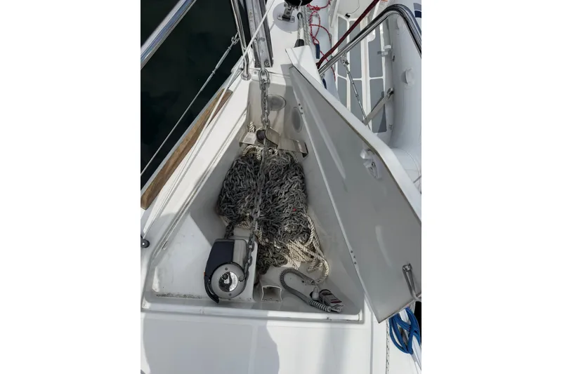 Slide: The Image of Anchor locker of 2022 Jeanneau Sun Odyssey 349 Performance sailboat with chain and rope. - 31