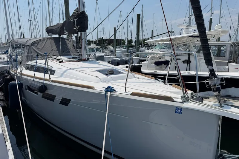 Slide: The Image of 2022 Jeanneau Sun Odyssey 349 Performance sailboat docked at a marina. - 39