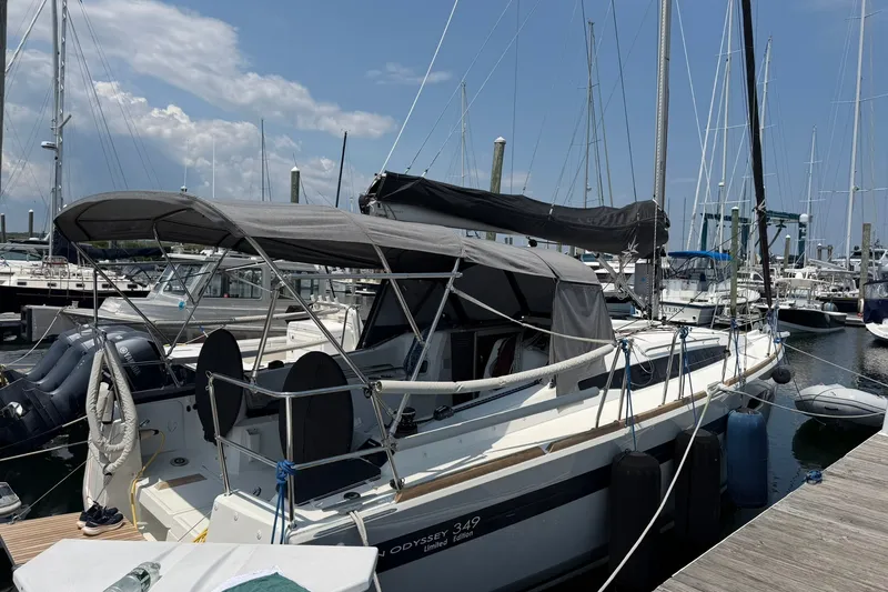 Slide: The Image of 2022 Jeanneau Sun Odyssey 349 Performance sailboat docked at marina under clear sky. - 38