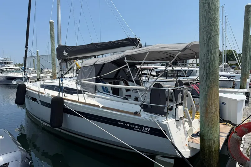 Slide: The Image of 2022 Jeanneau Sun Odyssey 349 Performance sailboat docked at marina. - 26