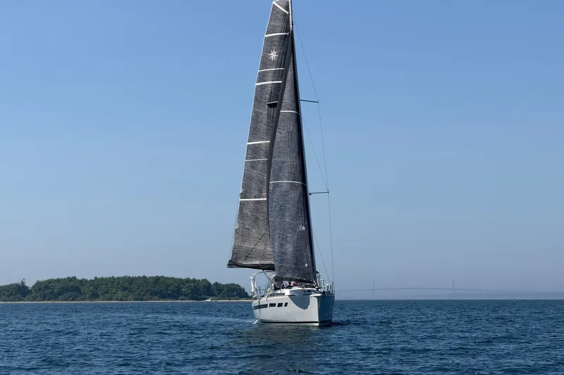 Slide: The Image of 2022 Jeanneau Sun Odyssey 349 Performance sailing on open water under clear skies. - 12